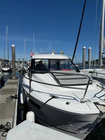 Pearl Yacht Photos Pics 2024 Jeanneau NC 895 docked at marina under clear blue sky.