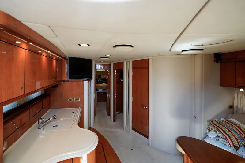  Yacht Photos Pics Interior of 2000 Sea Ray 510 Sundancer yacht with modern wood cabinetry and sleek design.