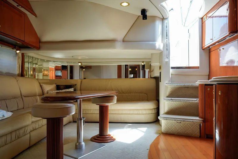  Yacht Photos Pics Luxurious interior of a 2000 Sea Ray 510 Sundancer yacht with elegant seating and wooden accents.