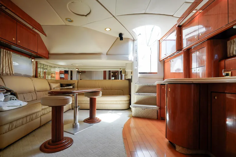  Yacht Photos Pics Luxurious interior of a 2000 Sea Ray 510 Sundancer yacht with elegant wood finishes.