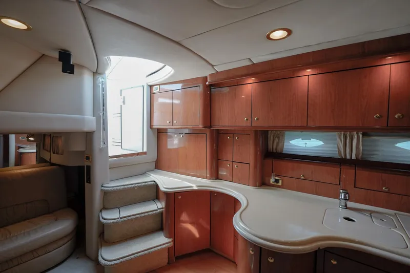  Yacht Photos Pics Luxurious interior of 2000 Sea Ray 510 Sundancer yacht with elegant wood cabinetry and modern design.