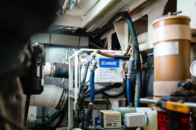  Yacht Photos Pics Engine room of 2000 Sea Ray 510 Sundancer with Cruisair system and various mechanical components.