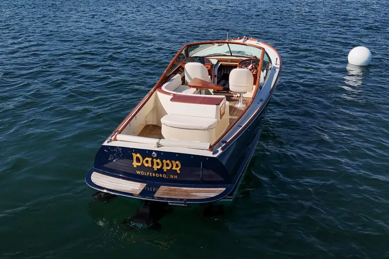 Pappy Yacht Photos Pics 2004 Hinckley Talaria 29 Runabout on water, rear view, elegant design.