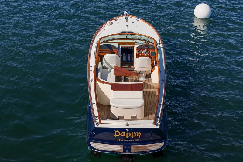 Pappy Yacht Photos Pics 2004 Hinckley Talaria 29 Runabout on water, featuring elegant design and luxurious seating.