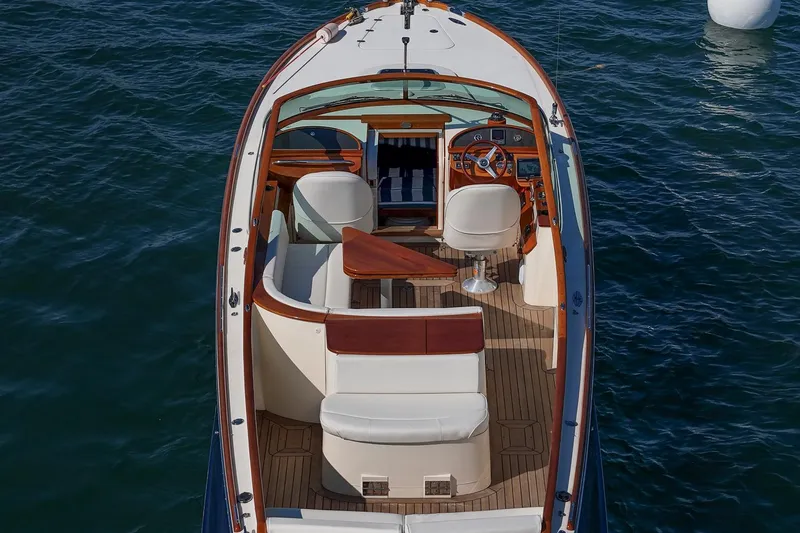 Pappy Yacht Photos Pics 2004 Hinckley Talaria 29 Runabout on water, featuring elegant wood and leather interior.