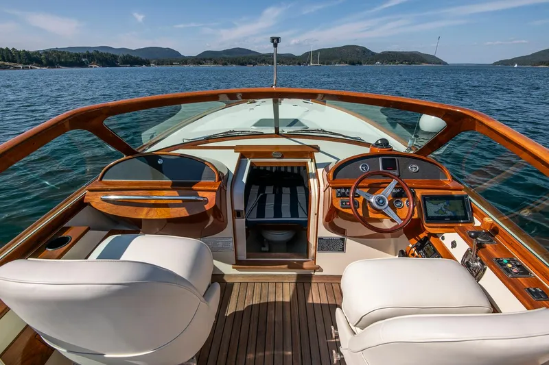 Pappy Yacht Photos Pics 2004 Hinckley Talaria 29 Runabout interior with wooden dashboard and leather seats on open water.