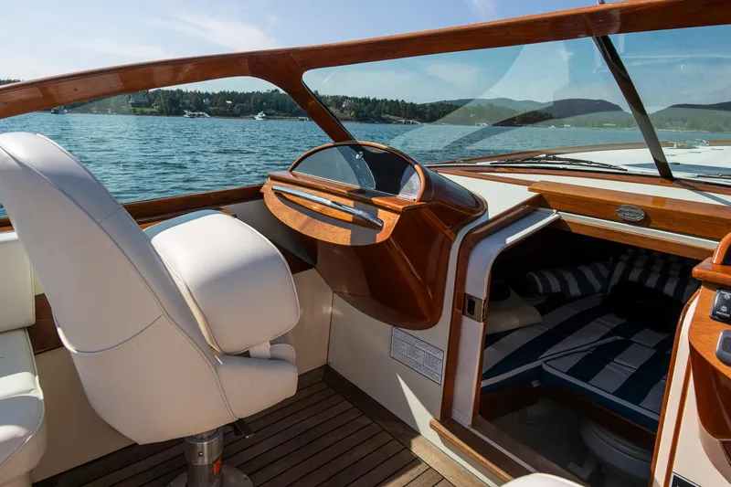 Pappy Yacht Photos Pics 2004 Hinckley Talaria 29 Runabout interior with elegant wood finish and comfortable seating.