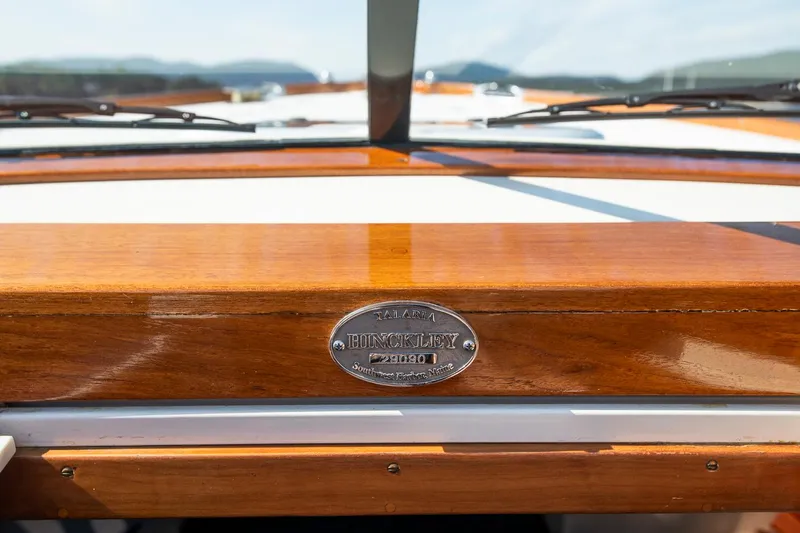 Pappy Yacht Photos Pics 2004 Hinckley Talaria 29 Runabout dashboard with polished wood finish and nameplate.