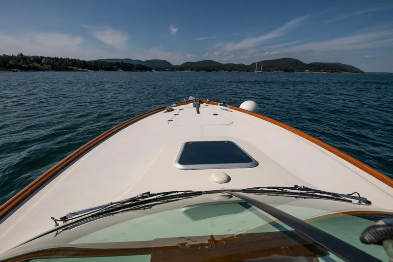Pappy Yacht Photos Pics Bow view of 2004 Hinckley Talaria 29 Runabout on open water.