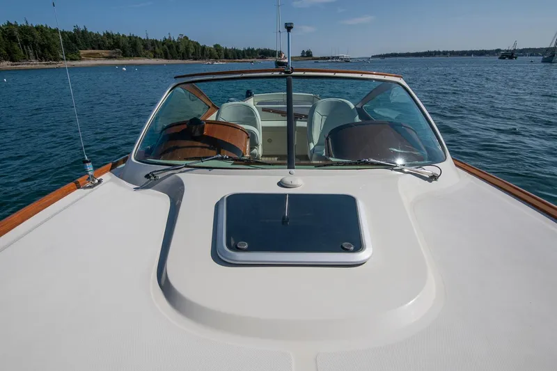 Pappy Yacht Photos Pics 2004 Hinckley Talaria 29 Runabout on calm water, showcasing sleek design and windshield.