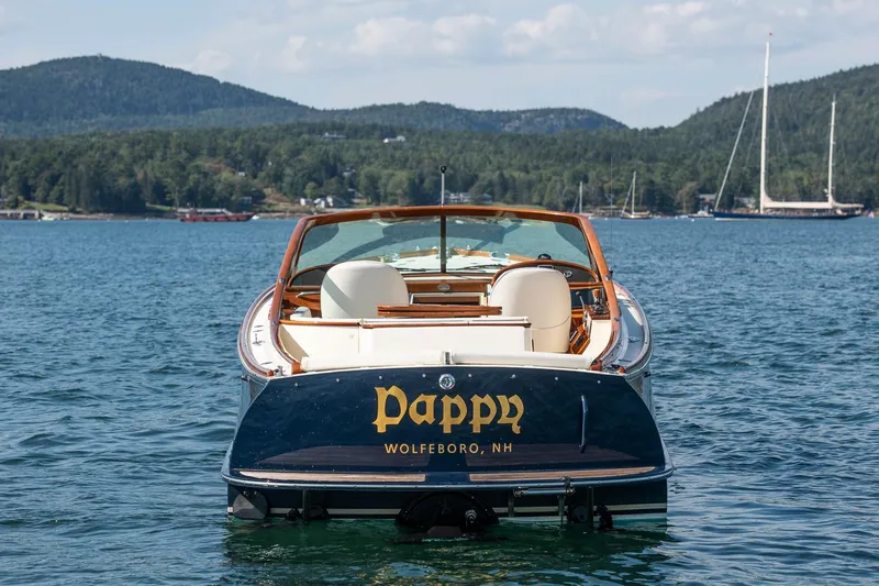 Pappy Yacht Photos Pics 2004 Hinckley Talaria 29 Runabout on water, scenic mountain backdrop, "Pappy" on stern.