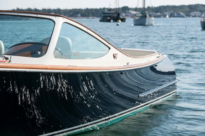 Pappy Yacht Photos Pics 2004 Hinckley Talaria 29 Runabout on calm water, showcasing sleek design and craftsmanship.