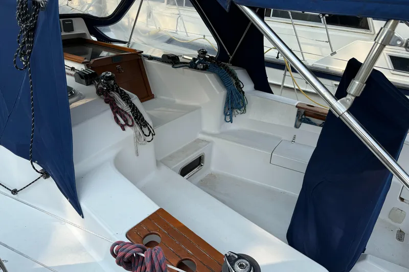 Nino Yacht Photos Pics Cockpit of 2007 Tartan 4100 sailboat with blue covers and ropes.