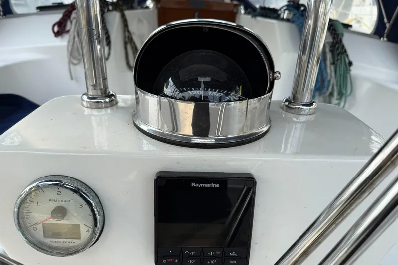 Nino Yacht Photos Pics Tartan 4100 yacht cockpit with compass, Raymarine display, and RPM gauge, 2007 model.