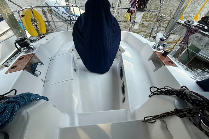 Nino Yacht Photos Pics 2007 Tartan 4100 sailboat cockpit with covered helm, ropes, and winches at dock.