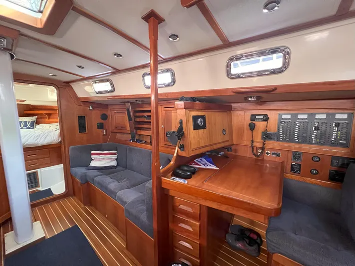 Nino Yacht Photos Pics Interior of 2007 Tartan 4100 sailboat with wood finish and navigation station.