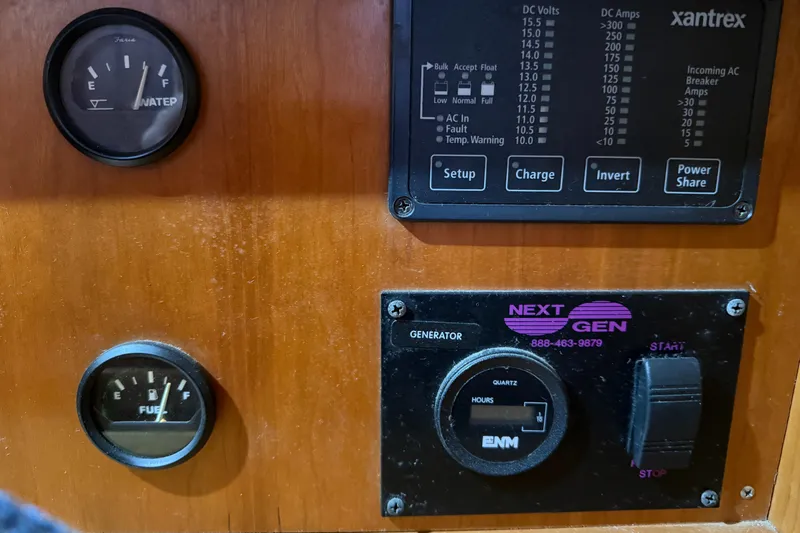 Nino Yacht Photos Pics Control panel of a 2007 Tartan 4100 sailboat with fuel and generator gauges.
