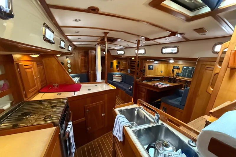 Nino Yacht Photos Pics Luxurious interior of 2007 Tartan 4100 yacht with wood finishes and modern amenities.