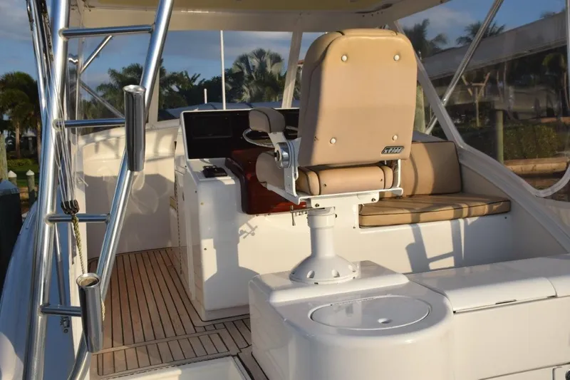 Osprey Yacht Photos Pics Teak decking on bridge deck and aft facing bench seat to right of helm.
