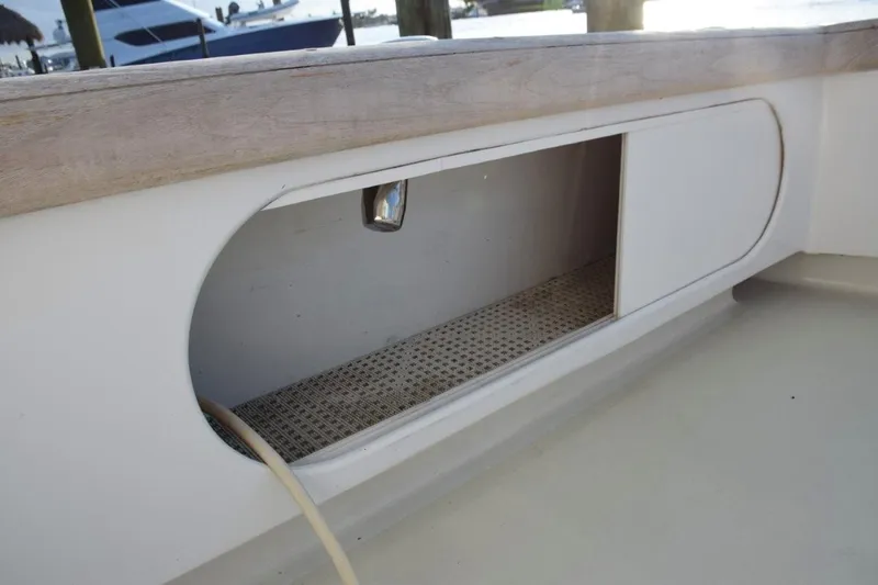 Osprey Yacht Photos Pics Slide opening cabinets beneath cockpit sides - electric reel plugs