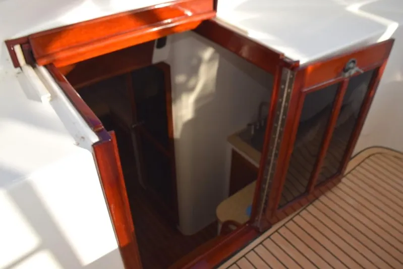 Osprey Yacht Photos Pics Locking entry door to cabin, teak and glass folding door with keeper and slide back solid top panel.