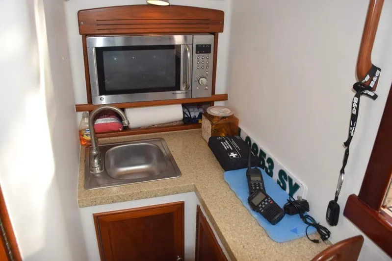 Osprey Yacht Photos Pics Galley area to starboard, Corian countertop, stainless steel sink