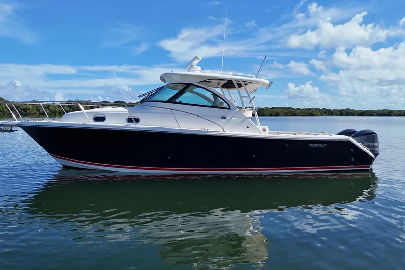  Yacht Photos Pics 2010 Pursuit OS 345 Offshore boat on calm water under blue sky.