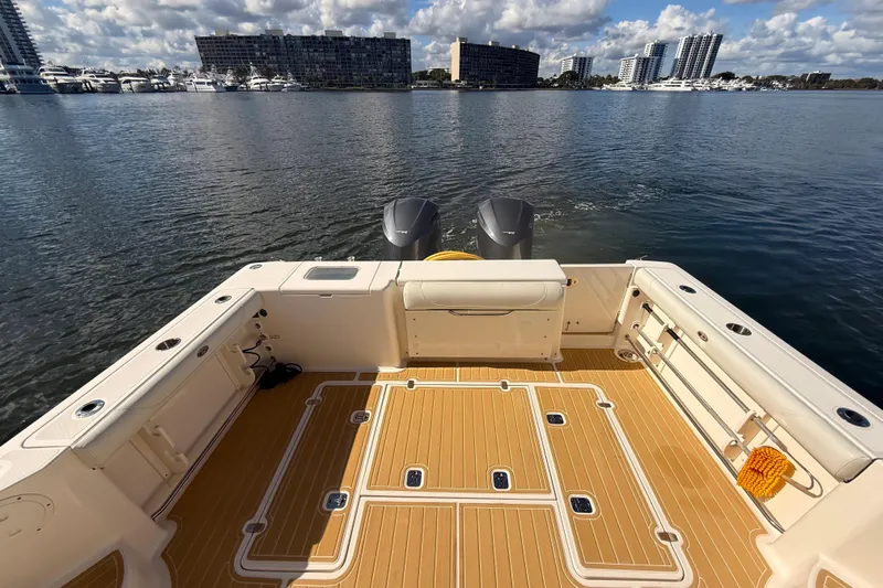  Yacht Photos Pics 2010 Pursuit OS 345 Offshore boat deck with scenic waterfront view.