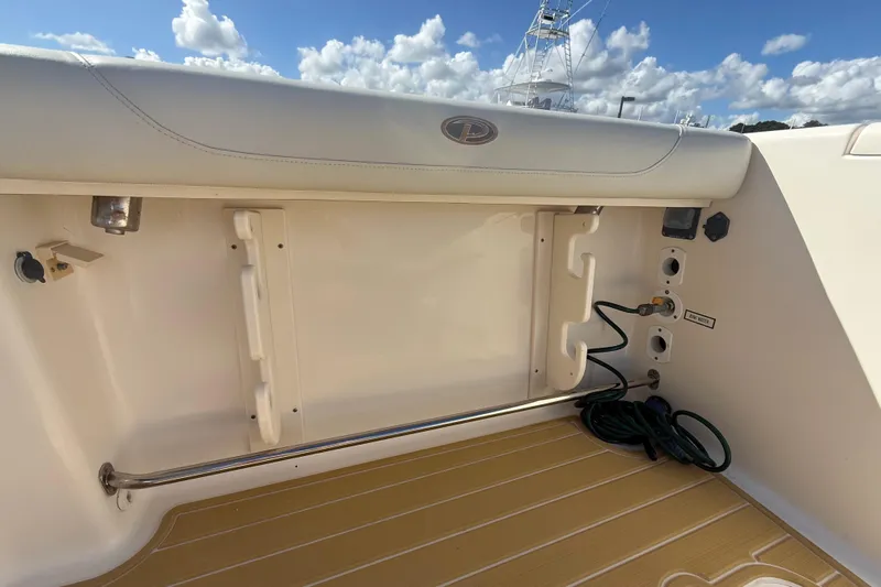  Yacht Photos Pics 2010 Pursuit OS 345 Offshore boat interior with storage and utility features.