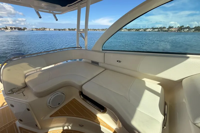  Yacht Photos Pics Luxurious seating area on 2010 Pursuit OS 345 Offshore boat with scenic water view.