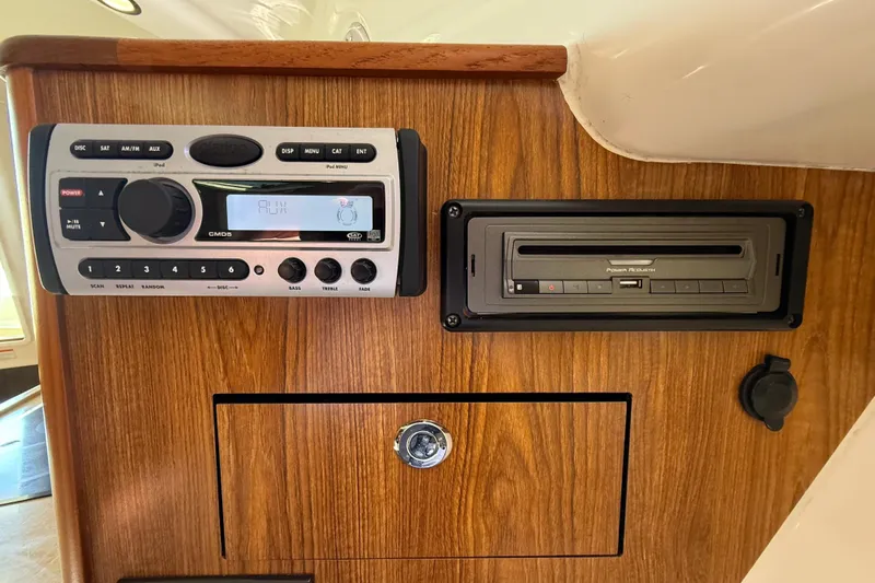  Yacht Photos Pics 2010 Pursuit OS 345 Offshore boat stereo system on wooden panel.