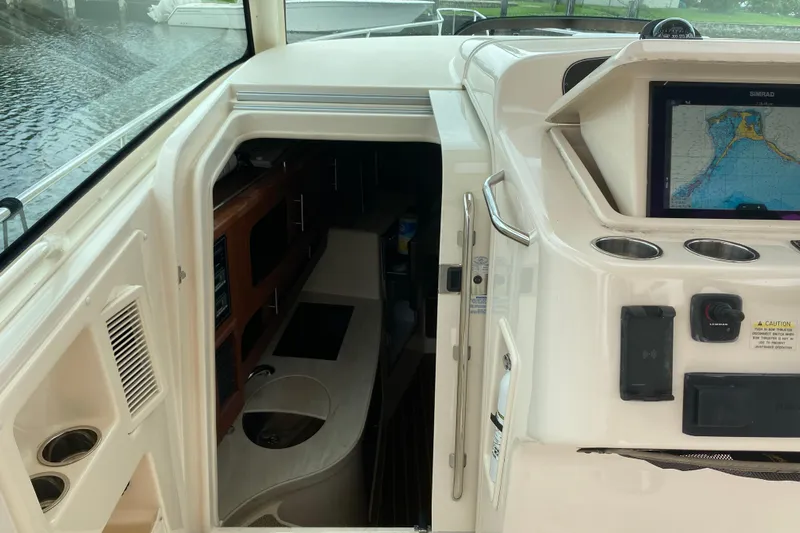  Yacht Photos Pics Interior view of a 2022 Grady-White Express 370 boat with navigation system.