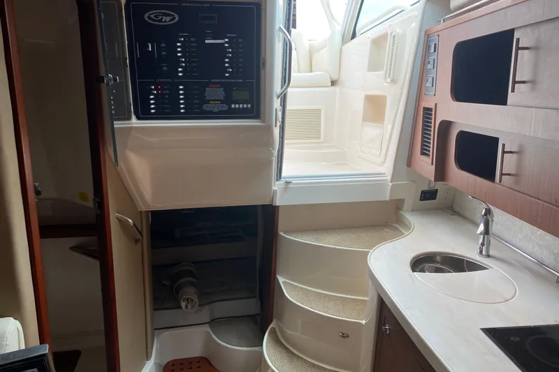  Yacht Photos Pics Interior of 2022 Grady-White Express 370 boat with control panel and kitchenette.