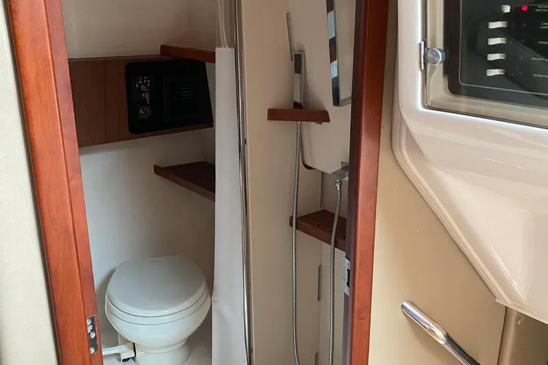  Yacht Photos Pics 2022 Grady-White Express 370 boat bathroom with toilet and shower.