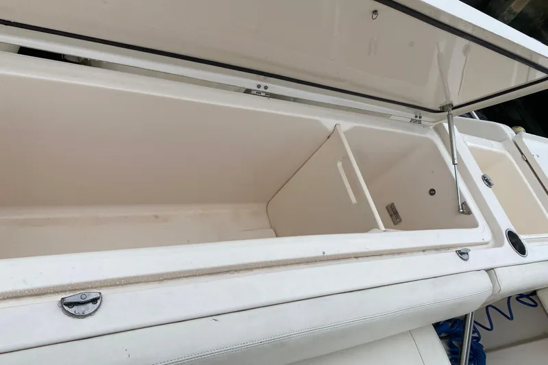  Yacht Photos Pics Open storage compartment on 2022 Grady-White Express 370 boat, showcasing spacious interior.