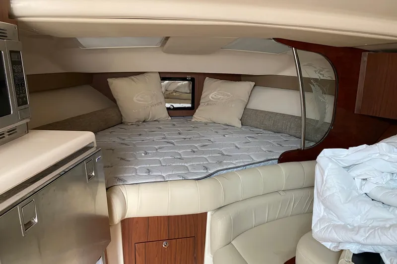  Yacht Photos Pics Luxurious cabin interior of 2022 Grady-White Express 370 boat with cozy bedding.
