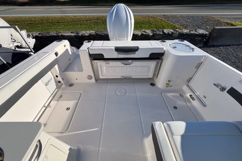  Yacht Photos Pics 2026 Robalo R257 Dual Console boat interior with seating and storage compartments.