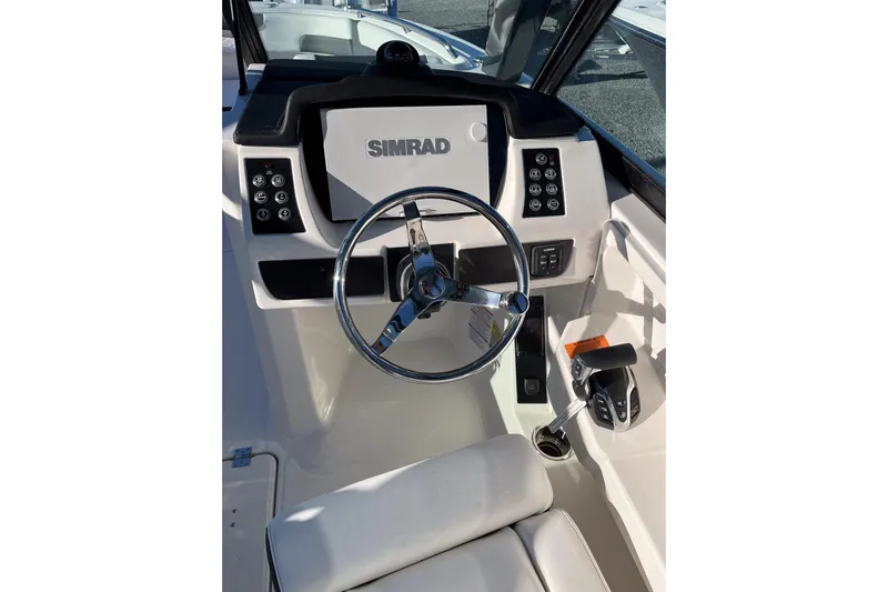  Yacht Photos Pics 2026 Robalo R257 Dual Console boat helm with Simrad display and controls.