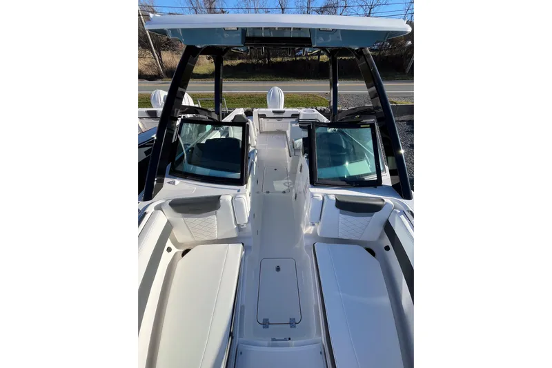  Yacht Photos Pics 2026 Robalo R257 Dual Console boat interior with seating and windshield.