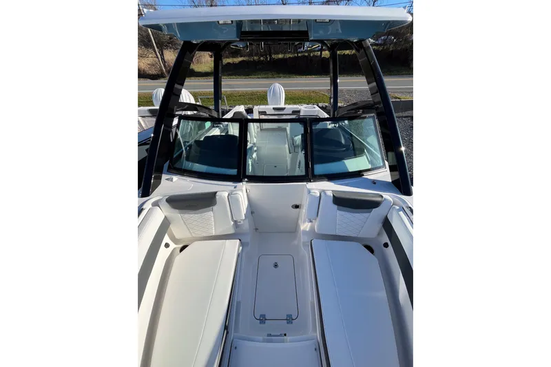  Yacht Photos Pics 2026 Robalo R257 Dual Console boat interior with seating and windshield.