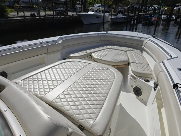 Yacht Photos Pics 2019 Boston Whaler 380 Outrage boat with luxurious seating and diamond-stitched upholstery.