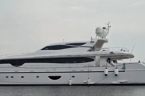 Sunshine Yacht Photos Pics Luxury Versilcraft Euroyacht Planet 125S Hardtop, 2010 model, docked on calm waters.