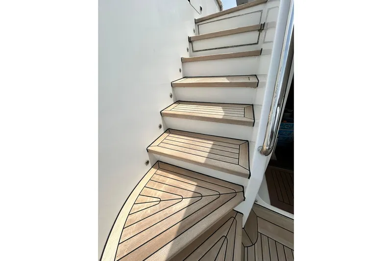 Sunshine Yacht Photos Pics Staircase on 2010 Versilcraft Euroyacht Planet 125S Hardtop, featuring sleek wooden design.
