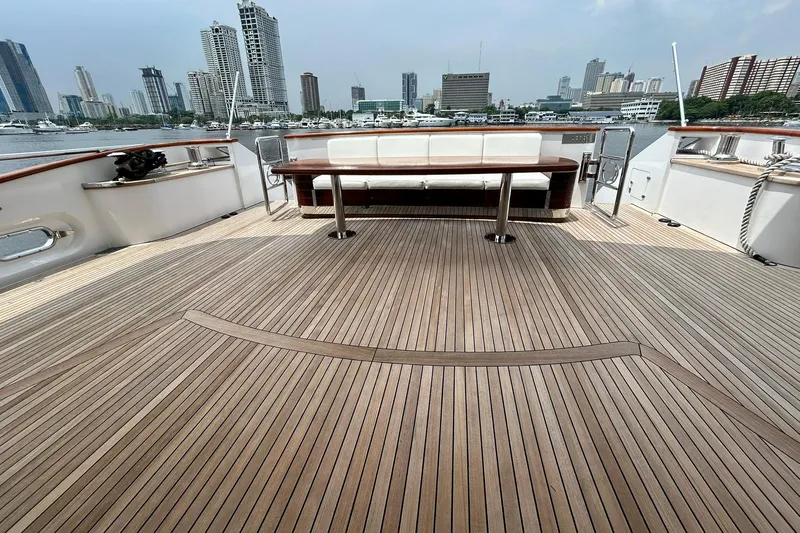 Sunshine Yacht Photos Pics Spacious deck of 2010 Versilcraft Euroyacht Planet 125S Hardtop with city skyline view.