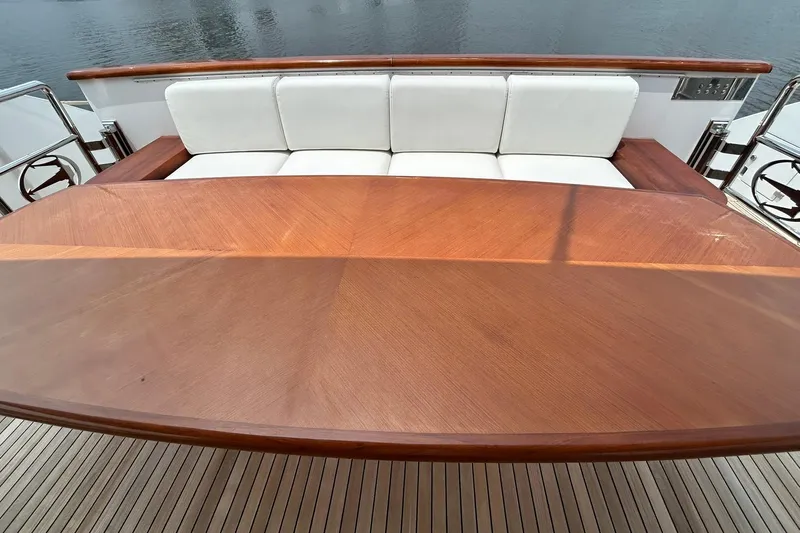 Sunshine Yacht Photos Pics Luxurious Versilcraft Euroyacht 125S Hardtop 2010, featuring elegant wooden table and white seating.