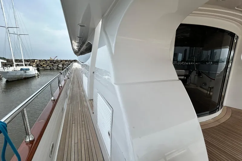 Sunshine Yacht Photos Pics Versilcraft Euroyacht Planet 125S Hardtop 2010, sleek deck view with marina backdrop.