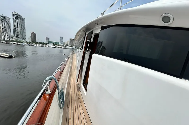 Sunshine Yacht Photos Pics 2010 Versilcraft Euroyacht Planet 125S Hardtop docked near city skyline.