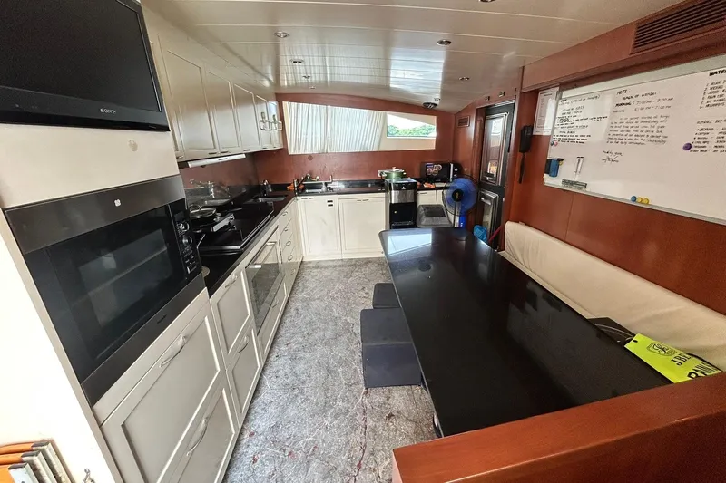 Sunshine Yacht Photos Pics Luxurious kitchen interior of 2010 Versilcraft Euroyacht Planet 125S Hardtop, featuring modern appliances.