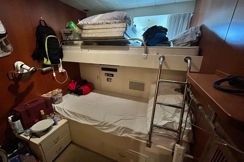 Sunshine Yacht Photos Pics Compact cabin interior of 2010 Versilcraft Euroyacht Planet 125S with bunk beds and storage.