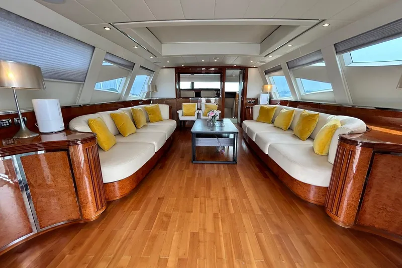 Sunshine Yacht Photos Pics Luxurious interior of 2010 Versilcraft Euroyacht Planet 125S with elegant seating and wooden accents.